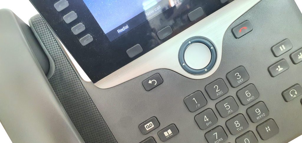 Close-up of a Cisco IP desk phone keypad and handset